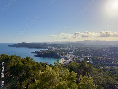view from the viewpoint at the lighthouse Far de Sant Sebastià over the landscape at the Costa Brava with the white villages Llafranc and Calella de Palafrugell during sunset, Catalonia, Spain