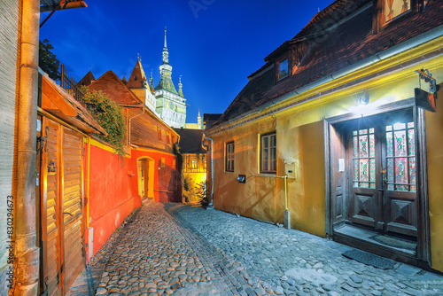 Amazing night view of historic town Sighisoara and Clock Tower built by Saxons.