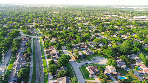 Suburban neighborhood with concrete channels facilitates drainage discharge into creek, cul-de-sac dead-end keyhole shape street, flood storage capacity to waterway desilting Dallas, TX, aerial