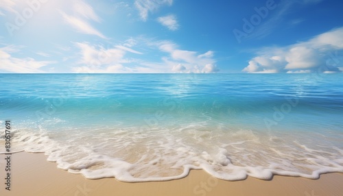 A tranquil beach scene with gentle waves lapping at the shore under a bright blue sky with fluffy clouds.