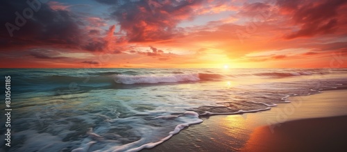 A stunning sunset by the beach displaying vibrant and captivating colors Perfect for a copy space image