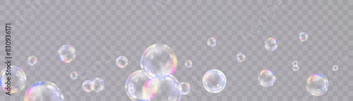 Realistic soap bubbles. Bubbles are located on a transparent background. Vector flying soap bubble.