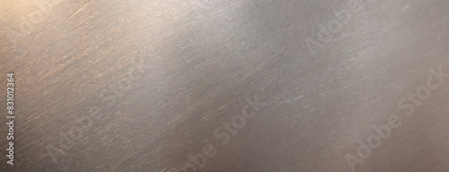 Matte grey metal background with subtle abrasions. The texture is understated yet distinctly industrial. Essence of worn material, ideal for rugged design themes.
