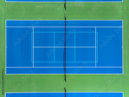 Aerial, drone, photo of new outdoor blue tennis court with white lines combined with light blue pickleball lines. 