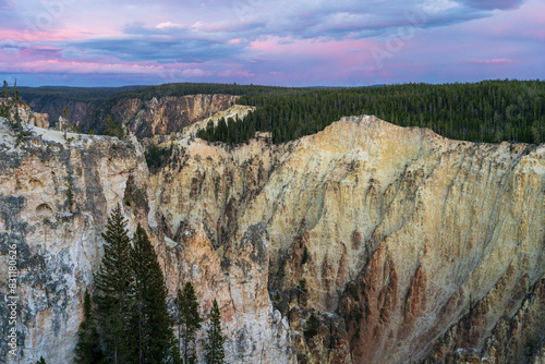 A pink and blue sunset over the Grand Canyon of the Yellowstone in Yellowstone National Park in Wyoming