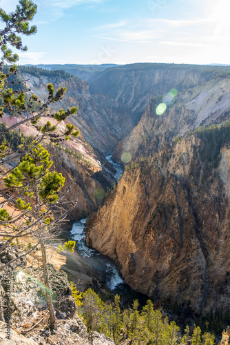 Early morning light on the rocks and cliffs at the Grand Canyon of the Yellowstone at Canyon Village in Yellowstone National Park in Wyoming on a sunny day