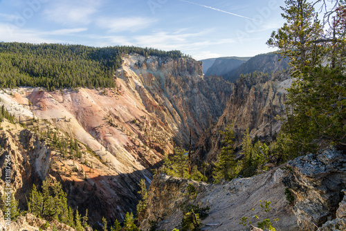 Early morning light on the rocks and cliffs at the Grand Canyon of the Yellowstone at Canyon Village in Yellowstone National Park in Wyoming on a sunny day