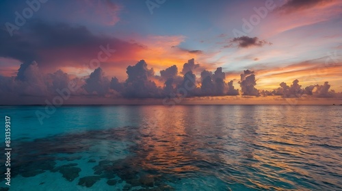 Stunning colorful sunset sky with clouds on the horizon of the South Pacific Ocean. Lagoon landscape in Moorea.