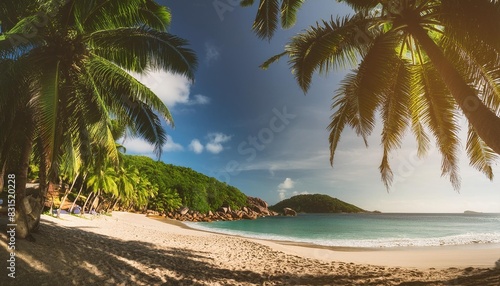 panorama of beautiful beach with coconut palms in tropical island seychelles summer vacation and tropical beach concept