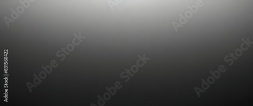 Grayscale soft noisy blurred grainy gradient background. Black and white wallpaper