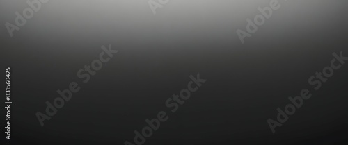 Grayscale soft noisy blurred grainy gradient background. Black and white wallpaper