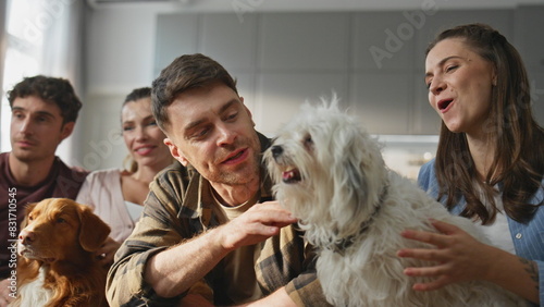 People dogs resting home together close up. Happy group friends caressing pets