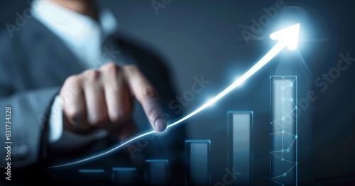 Businessman pressing growth graph. Businessman points to upwardly sloping line on bar graph.