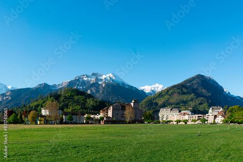 Parks and buildings in Interlaken Switzerland in the background is mountains