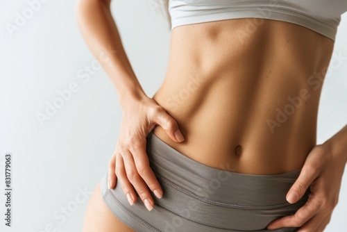 toned and slim female waistline with flat stomach, healthy fit body detail inspiring fitness