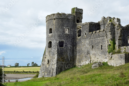 Carew Castle in Wales exterior view over the nearby river is an historic point of interest for tourists to visit