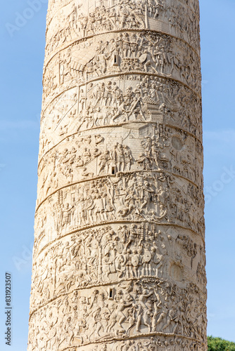 Rome, Italy - April 11, 2024: View of the trajan's column in Rome with tourists crowding its surroundings in Rome, Italy