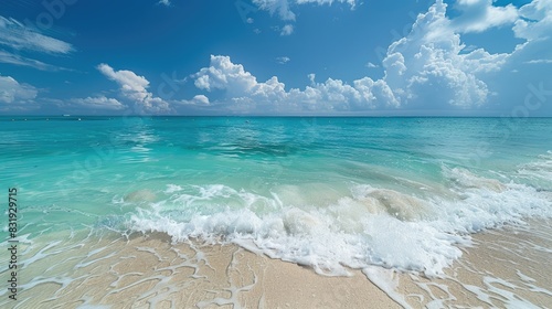 Crystal clear turquoise sea with gentle waves lapping the shore under a bright blue sky, perfect for a tropical escape