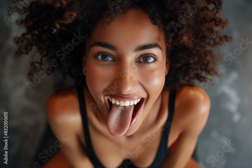 A woman sticking out her tongue in a humorous expression