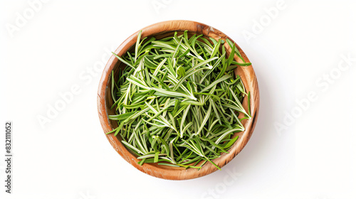 Bowl of dry tarragon isolated on white top view