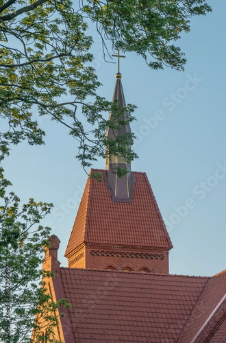 The tower, spire and tiled roof of the German church
