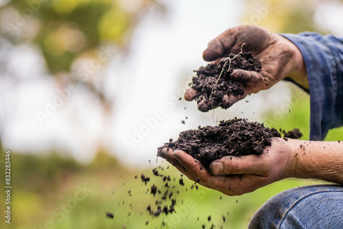 farmer holding soil taking a soil sample for a soil test in a field. Testing carbon sequestration and plant health in Australia