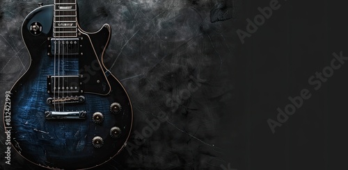 a image of a blue electric guitar sitting on top of a black background