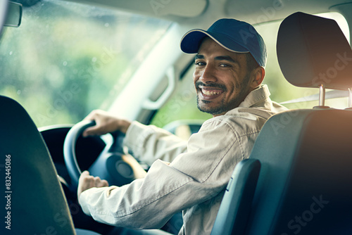 Portrait, driver or delivery man with smile for safety on cargo, stock or package in van in shipping business. Parcel order, car or happy courier driving in transportation for supply chain or freight