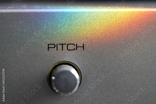 Using a pitch wheel on a MIDI musical keyboard. with rainbow colors.