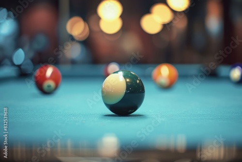 A pool table with a single pool ball resting on its surface, ready for a game