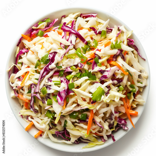 Top view of a bowl of coleslaw with creamy dressing isolated on white background 