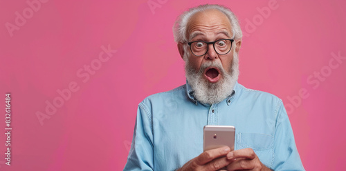 Amazed Senior Man Using Smartphone with Surprised Expression