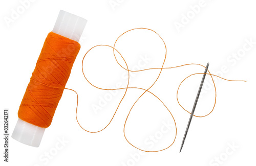 Old spool of thread and needle on a white background. Sewing accessories