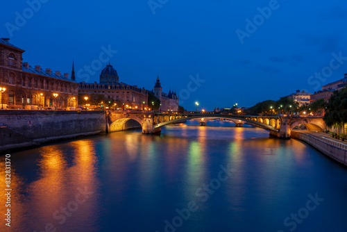 Twilight over seine river with parisian bridges