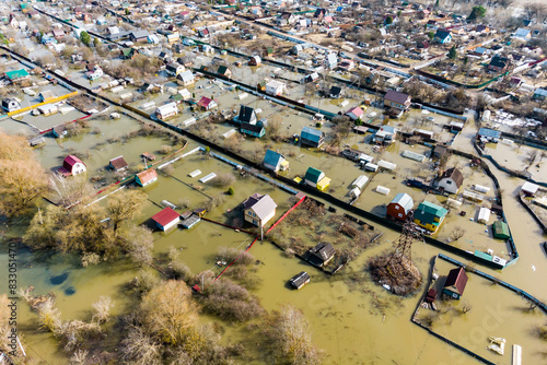 View from above of village buildings during spring flood
