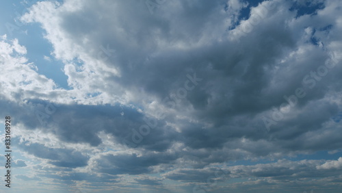 Sky after the storm. Majestic amazing blue sky with stratocumulus clouds. Nature stratus clouds moving. Timelapse.