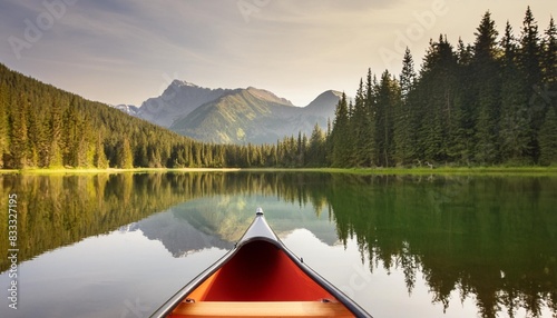 Canoeing on a forest lake in the mountains