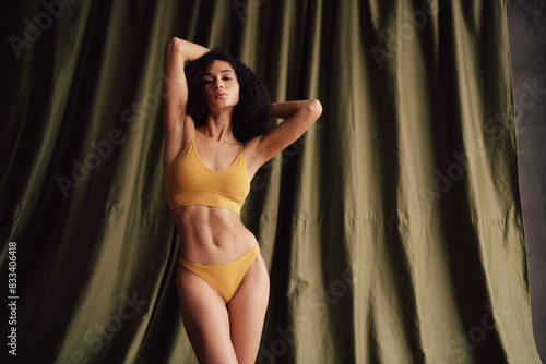 No retouch photo of stunning charming girl wear trendy yellow activewear isolated on textile khaki color background