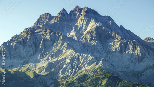 fault-block mountains with sharp, angular peaks under a clear blue sky