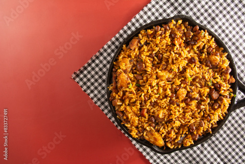 Baião de Dois traditional Brazilian food with rice, beans, sausage and rennet cheese close up