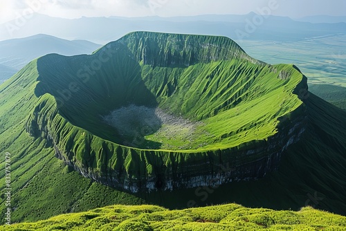 Digital artwork of large green mountain with the shape of an irregular cone, surrounded