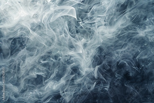 Wispy tendrils of smoke dance across a swirling background in shades of gray
