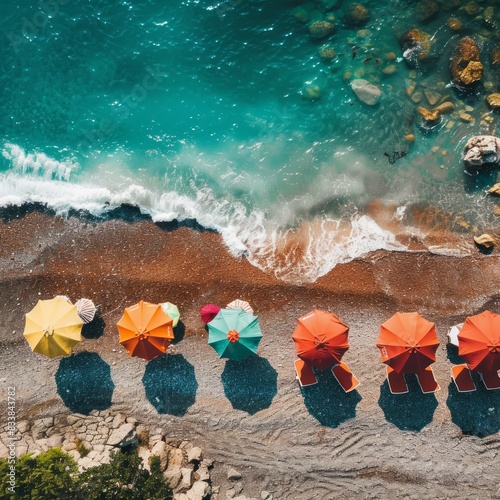 Beautiful sea beach view There are beautiful colorful umbrellas. Photos from a drone Job.