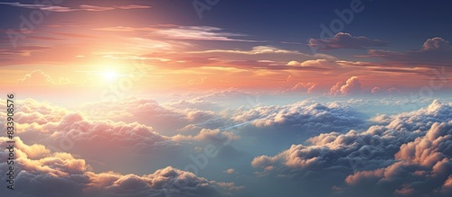 A scenic view of clouds over a serene landscape with a mystical sunset background, perfect for a copy space image.