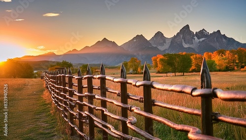 october 3 2018 ridgway colorado usa sunrise on worm western fence in front of san juan mountains in old west of southwest colorado near ridgway