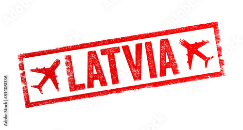 Latvia - is a country in the Baltic region of Northern Europe, text emblem stamp with airplane