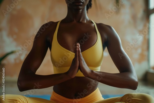 Black Yoga. African American Yogini in Closeup Doing Ardha Padmasana, Half Lotus Pose with Mudra Gesture