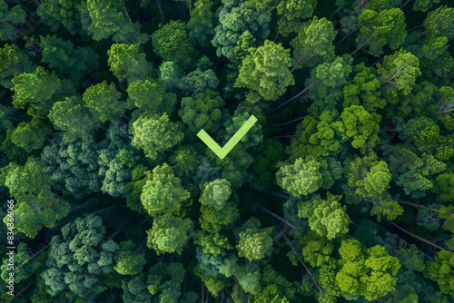 A checkbox icon with an aerial view of a green forest in the background, indicating full compliance with environmental regulations.