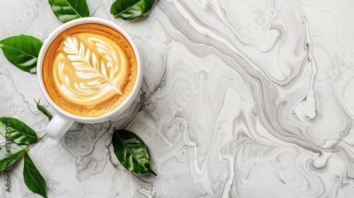  A cup of cappuccino atop a marble surface, adorned with a single leaf Green foliage encircles the scene, framing the cup and its steaming