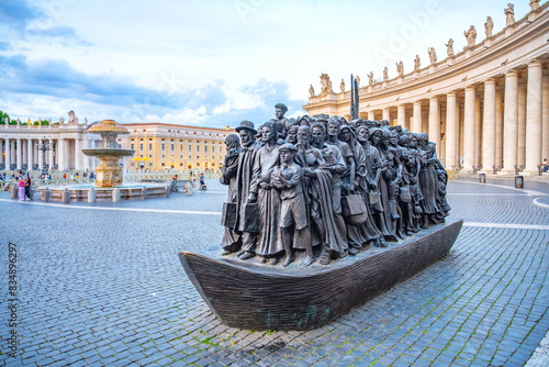 The Angels Unawares statue in Saint Peters Square, Vatican City. The bronze sculpture depicts a group of people of diverse backgrounds, symbolizing the idea of welcoming the stranger.